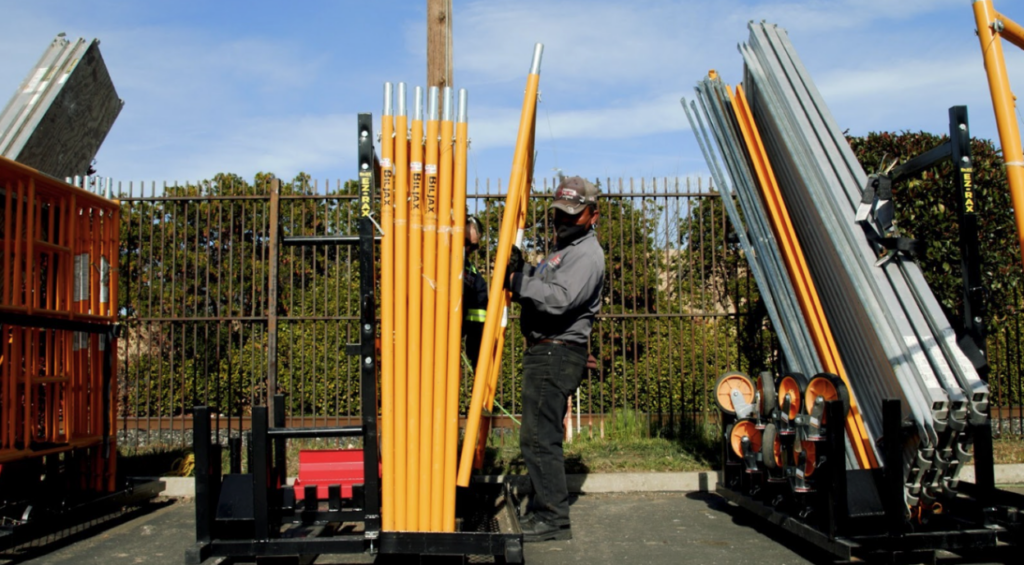 A worker unloads Bil-Jax’s Pro-Jax Utility Scaffold. 